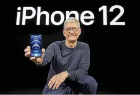  ?? (AFP) ?? Apple CEO Tim Cook holds up the all-new iPhone 12 Pro during an Apple event at Apple Park in Cupertino, California on Tuesday