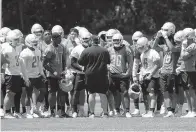  ?? AP Photo/Paul Sancya ?? ■ Detroit Lions head coach Matt Patricia talks with players after practice Monday in Allen Park, Mich.