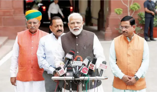  ?? Reuters ?? ↑ Narendra Modi speaks with the media on the opening day of the parliament session in New Delhi on Monday.