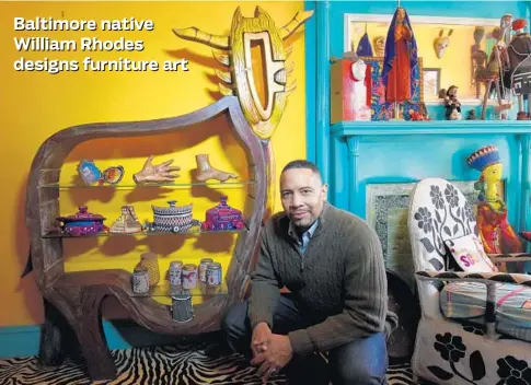  ?? KIM HAIRSTON/BALTIMORE SUN PHOTOS ?? William Rhodes, a mixed-media artist and art furniture maker from West Baltimore, with an intricatel­y carved wooden bookcase he made for local artist Joyce J. Scott. “With client commission­s, I try to infuse elements of their personalit­y using my own...