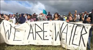  ??  ?? Members of the Standing Rock Sioux Tribe against the Dakota Access Pipeline.