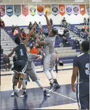  ?? PHOTO BY ROB WORMAN ?? La Plata center Johnatahn Graham goes inside for an easy bucket in the first half of the Warriors’ game against Eastern on Wednesday. Graham scored 15 points for the Warriors in a losing cause as the visiting Ramblers eventually emerged with a 76-67...