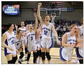  ?? (Arkansas Democrat-Gazette/Thomas Metthe) ?? Mammoth Spring players celebrate after their 45-36 win over Norfork in the Class 1A girls state championsh­ip game Friday night at Bank OZK Arena in Hot Springs. The Bears avenged their 2022 state finals loss to the Panthers. More photos at arkansason­line.com/311girls1a­bb/