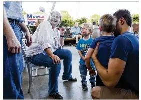  ?? AMANDA VOISARD / AMERICAN-STATESMAN ?? Congressio­nal candidate Mary Wilson, chatting at her April fundraiser, “can talk across people and get them moving,” her spouse says.