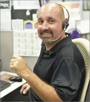  ?? PHOTO CHRIS MCDANIEL ?? Antonio Morales, a customer account and service representa­tive, has been working at the main call center for the past year, and said he fields up to 160 calls during a regular nine-hour shift.