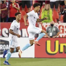  ?? AP FILE ?? ON HIS WAY OUT: Revolution midfielder and Canadian internatio­nal Tajon Buchanan, right, will join Club Brugge of Belgium following the MLS season in a transfer worth a reported $7 million.