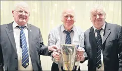  ?? ?? John Arnold holding the London SHC Cup with Gerry and Matt Rea on his visit last Saturday.