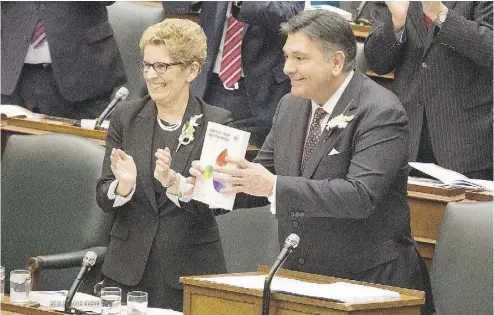  ?? PETER J. THOMPSON / NATIONAL POST ?? Ontario Premier Kathleen Wynne and Finance Minister Charles Sousa present the 2016 budget Thursday.