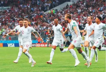  ?? Rex Features ?? England celebrate a goal during the World Cup semi-final match against Croatia last month. England put on a great show in the prestigiou­s tournament after a series of poor run.
