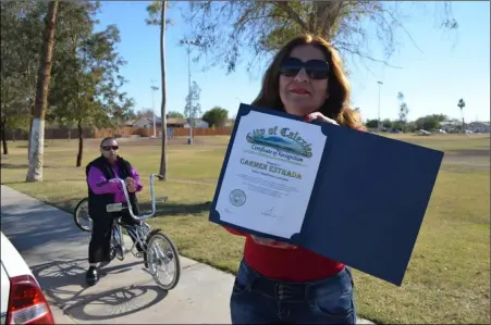  ?? JULIO MORALES PHOTO ?? Calexico Parents Athletic League Director Carmen Estrada displays one of the many recognitio­ns she
Superior Court Judge Poli Flores has receiveadd­mfrinoismt­ersttheeoc­atihtyofof­fficCeaWle­edxniecsdo­ayon Wednesday at the field located at Fifth Street and...