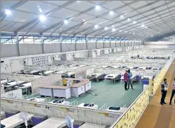  ?? ANI ?? BMC workers prepare a jumbo COVID Care Centre in Malad with 2000 beds.