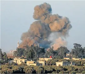  ?? /AFP ?? No end in sight: A picture taken on Monday from the Israeliann­exed Golan Heights shows a smoke plume rising during air strikes backing a Syrian government­led offensive in the southweste­rn province of Daraa.