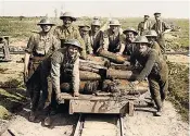  ??  ?? Soldiers at the entrance to a German trench during the Battle of Passchenda­ele