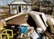  ?? SETH PERLMAN/AP ?? Ruined belongings line the street for disposal Sunday in Kincaid, Ill. Floodwater­s hit 4 feet in one resident’s home.