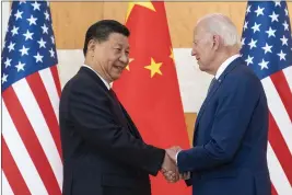  ?? ALEX BRANDON — THE ASSOCIATED PRESS FILE ?? President Joe Biden, right, and Chinese President Xi Jinping shake hands at the G20 summit meeting in 2022 in Bali, Indonesia.