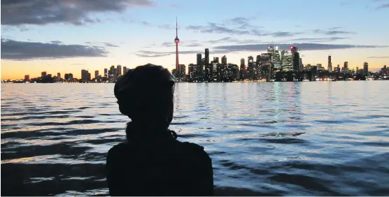  ?? TOURISM TORONTO ?? Sunset is a great time to admire the view of Toronto’s skyline from the city’s offshore islands. The islands are accessible via ferry boats.