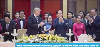  ??  ?? HANOI: Vietnamese President Tran Dai Quang (right) and US President Donald Trump attend a state dinner in Hanoi yesterday. Trump arrived in the Vietnamese capital after attending the Asia-Pacific Economic Cooperatio­n (APEC) Summit leaders meetings...