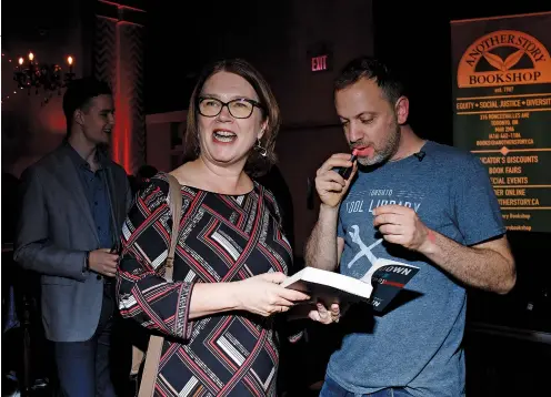  ??  ?? Independen­t MP Jane Philpott was among those who had their copies adorned with a lipstick kiss from Meslin at the recent launch of his new book