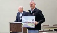  ?? / kevin Myrick ?? Glenn Robinson and Jeff Hawkins showed off an artists rendering produced by Rockmart’s Susan Waters to the Cedartown City Commission during their March work session.
