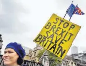  ??  ?? WON’T GIVE UP! An anti-brexit campaigner holds a banner near the parliament in London on Tuesday.
AP