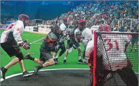  ?? SARAH GORDON/THE DAY ?? New England Black Wolves’ Kevin Buchanan (27) falls as he attempts a shot on goal during a game at Mohegan Sun Arena in April.