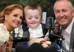  ??  ?? BROKENHEAR­TED: Michael pictured with his loving foster parents Ann Higgins and Barry McCabe Alan O’Keeffe