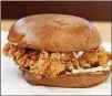  ?? NICK KINDELSPER­GER/CHICAGO TRIBUNE/TNS ?? The chicken in Popeye’s sandwich crunches audibly when you bite in.