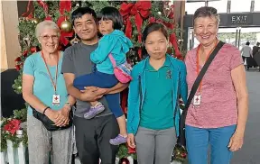  ??  ?? Myanmar former refugees Thang Lam, Vung Deih Cing, Niang Khan Lun with Nelson Red Cross volunteer Elena Meredith and Sue Cooper on the family’s arrival at Nelson Airport last year.