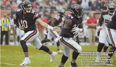  ?? AP PHOTO ?? GROWLING BEARS: Quarterbac­k Mitchell Trubisky (10) and tailback Jordan Howard (24) are two of the many dangerous Bears weapons the Patriots will deal with Sunday in Chicago.