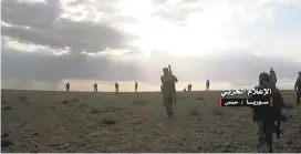  ?? SYRIAN CENTRAL MILITARY MEDIA/ASSOCIATED PRESS ?? This Thursday handout photo shows Syrian troops taking up positions during fighting with Islamic State group militants in the Syrian province of Homs.