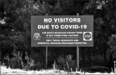  ?? C.M. CLAY/WHITE MOUNTAIN APACHE TRIBE VIA AP ?? IN THIS JUNE 25 PHOTO, a sign alerts motorists that visitors are not allowed on the Fort Apache Indian Reservatio­n in eastern Arizona.