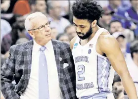  ?? AP ?? FEEL IT OUT: Joel Berry II (right) and Carolina coach Roy Williams will need to manage the point guard’s ankle injuries in Monday’s national final.