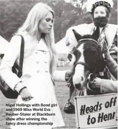  ??  ?? Nigel Hollings with Bond girl and 1969 Miss World Eva Reuber-Staier at Blackburn show after winning the fancy dress championsh­ip