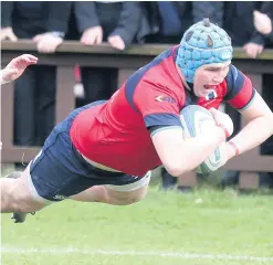  ??  ?? Tough test: Ballyclare’s Ethan Crawford crossed for a try but it wasn’t enough to see his side progress against Rainey