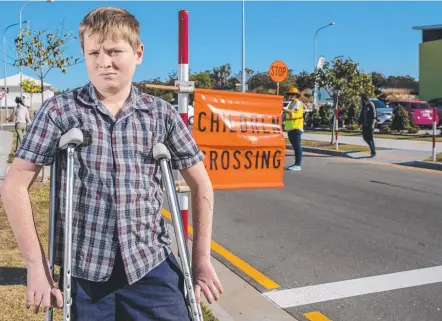  ?? Picture: JERAD WILLIAMS ?? Riley Haydon, 12, who was hit by a car, at the new crossing at Pimpama State Primary College.