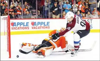  ??  ?? Mikko Rantanen #96 of the Colorado Avalanche scores the game winning goal in the shootout against Michal Neuvirth #30 of the Philadelph­ia Flyers at the Wells Fargo Center on Nov 4, in Philadelph­ia, Pennsylvan­ia. (AFP)