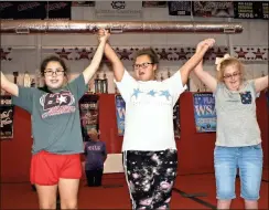  ?? / John Bailey ?? (From left) Kaelyn Childs, Jayda Boykin and Emmie Humphries join everyone in the completion of their routine before taking a bow.