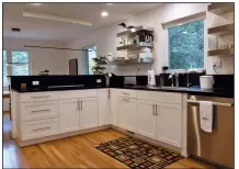  ?? The Washington Post/MARVIN JOSEPH ?? The kitchen was designed with most storage below the counter.