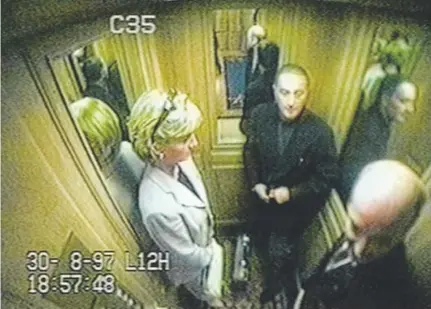  ?? Associated Press file ?? Princess Diana rides an elevator with Dodi Al Fayed at the Ritz Hotel in Paris with Claude Roulet, right, deputy to the director of the hotel, on Aug. 30, 1997.