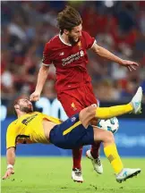  ?? REX ?? Key man: Adam Lallana was injured against Atletico Madrid