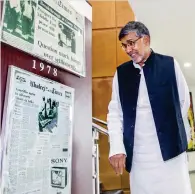  ??  ?? IMprEssED: Nobel laureate kailash satyarthi looks at the first edition of Khaleej Times during his visit to the kT office in Al Quoz on Thursday. — Photo by Leslie Pableo