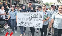  ?? MALUDING DEETO ?? Locals gather in downtown Yala to denounce the perpetrato­rs of violence. The placard says: ‘We will not let terrorists rule us’.