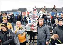  ??  ?? On song: Newport fans enjoy Cup tie with Manchester City