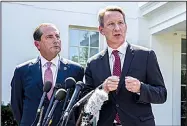  ?? AP/ALEX BRANDON ?? Alex Azar (left), Health and Human Services secretary, and Ned Sharpless, acting commission­er of the federal Food and Drug Administra­tion, discuss the vaping policy Wednesday outside the White House.