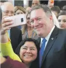  ?? JACQUELYN MARTIN/ AP ?? A State Department employee takes a selfie with new Secretary of State Mike Pompeo after he addressed department employees on May 1.