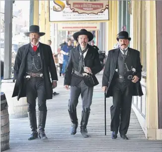  ??  ?? A TRIO portrays Wyatt Earp, Doc Holliday and Bat Masterson in Virginia City, Nev., where Samuel Clemens worked at a newspaper and came up with his pen name, Mark Twain.