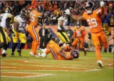  ?? JACK DEMPSEY — THE ASSOCIATED PRESS ?? Broncos defensive end Shelby Harris (96) intercepts a pass in the end zone against the Steelers during the second half of Sunday’s game in Denver. The Broncos won 24-17.