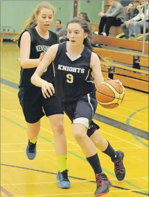  ?? JASON SIMMONDS/TC MEDIA ?? Alexa Rancourt, 9, of the Grace Christian Knights looks to stay ahead of the Kensington Torchettes’ Callie Champion during a P.E.I. School Athletic Associatio­n Senior AA Girls Basketball League quarter-final game. Grace Christian won the contest, which...