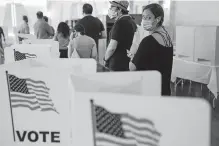  ?? [ELIJAH NOUVELAGE/GETTY IMAGES VIA USA TODAY] ?? People wait in line to vote in Georgia's Primary Election on June 9 in Atlanta.