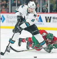  ?? CP PHOTO ?? In this March 21 photo, San Jose Sharks’ Patrick Marleau, white jersey, gains control of the puck against Minnesota Wild’s Jared Spurgeon in the second period of an NHL game in St. Paul, Minn. Marleau has left the Sharks and signed an $18.75 million,...